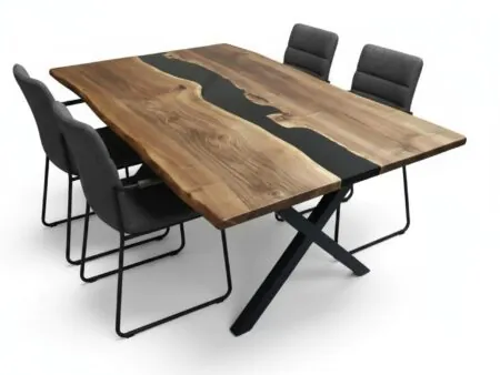 Modern live edge black resin epoxy dining table made of walnut wood in a contemporary dining room.