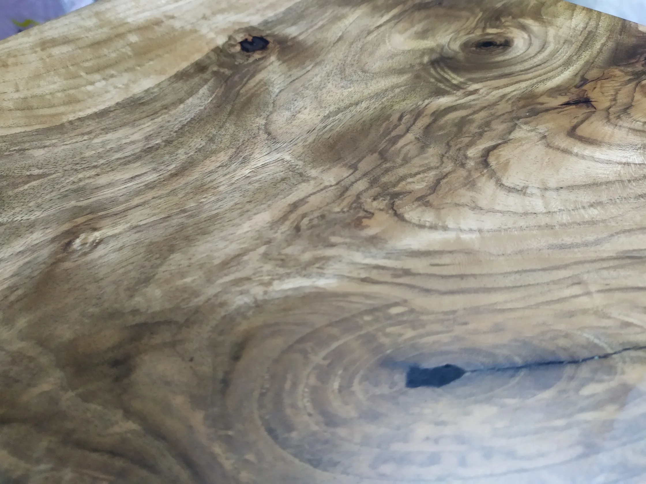 Natural walnut grain and live edge detail