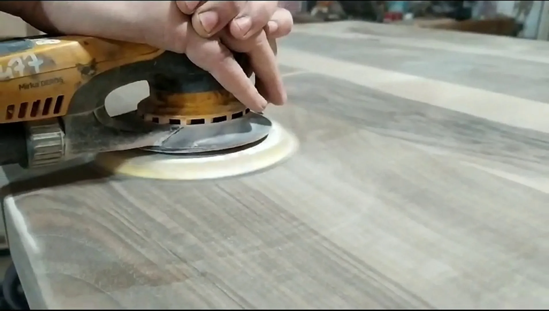 Woodworker crafting live edge walnut handmade dining table