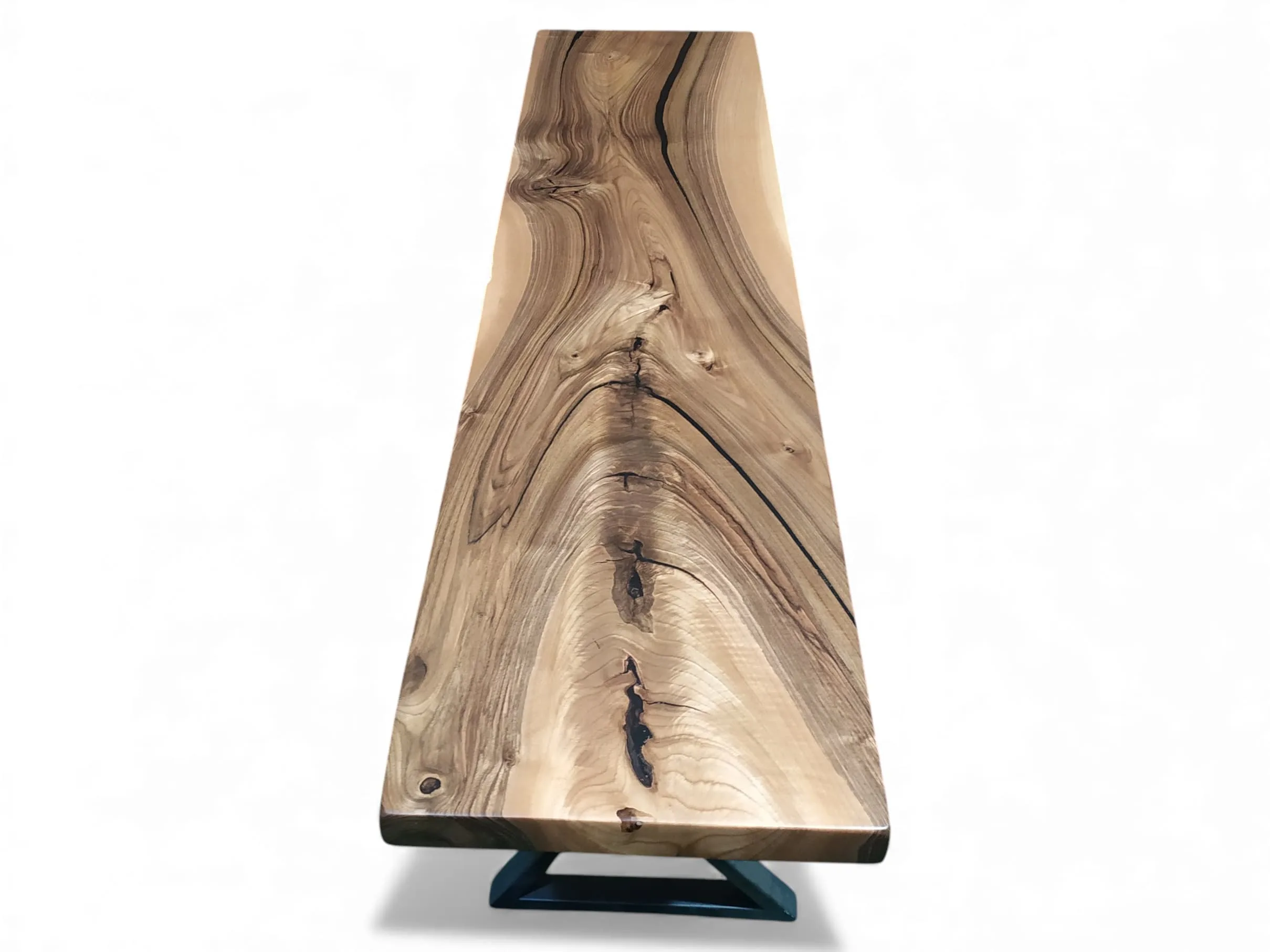 Walnut wood bench photographed from the side angle in a modern interior