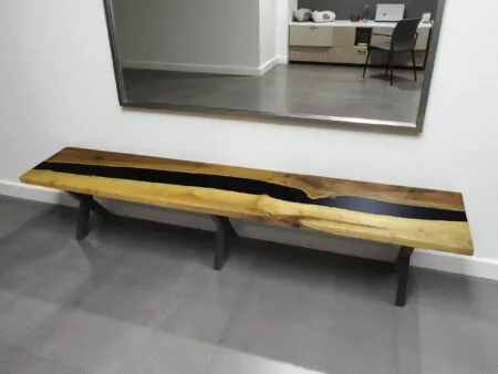 Epoxy walnut bench in modern entryway