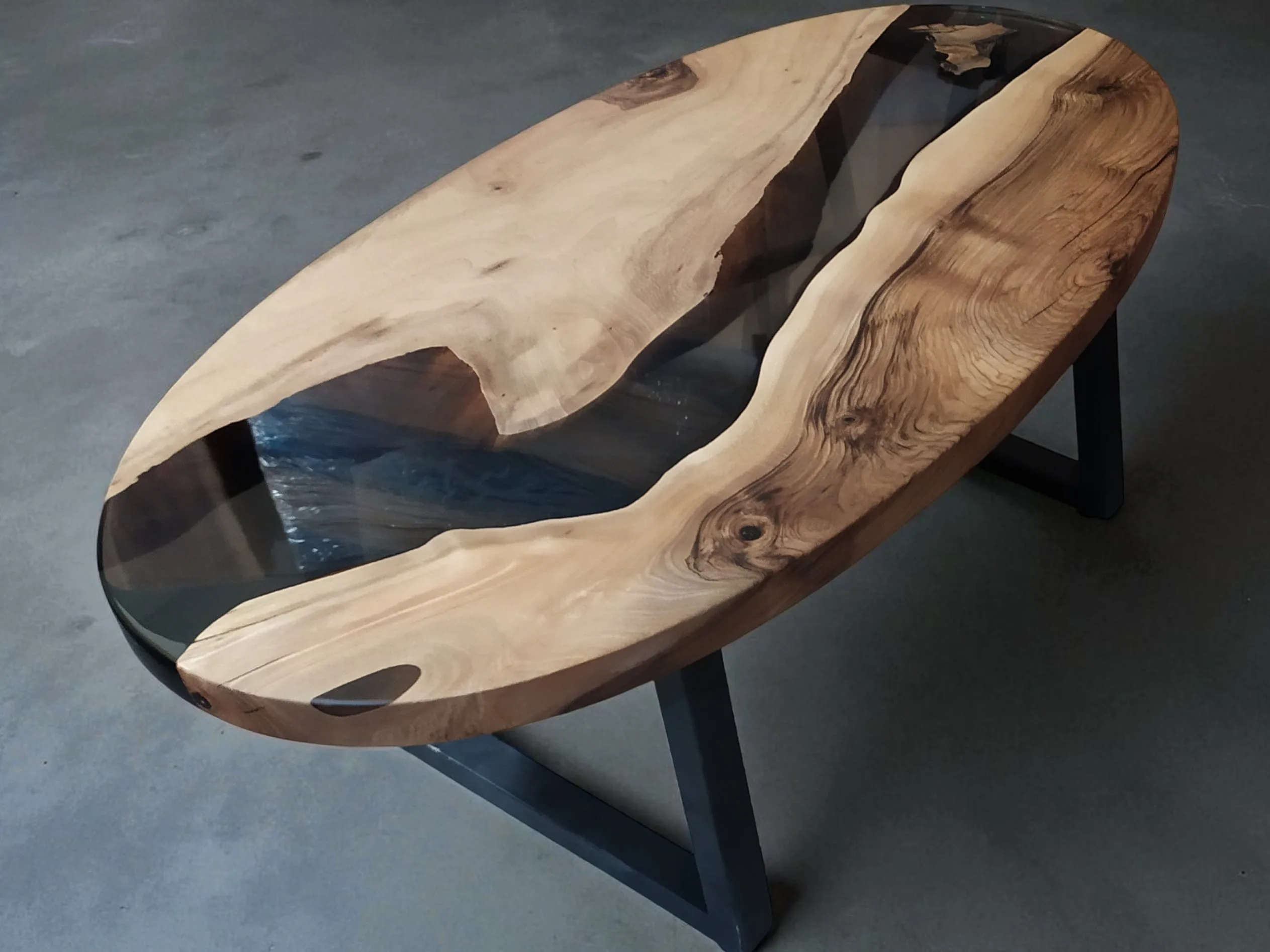 handcrafted oval coffee table with wood and resin