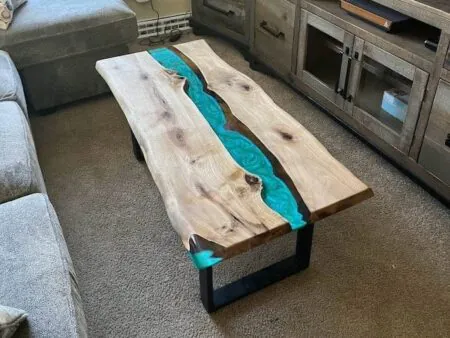 A live edge wood furniture styled in a modern living room decor.