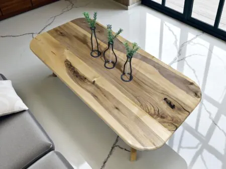 Walnut coffee table with smoothly rounded edges
