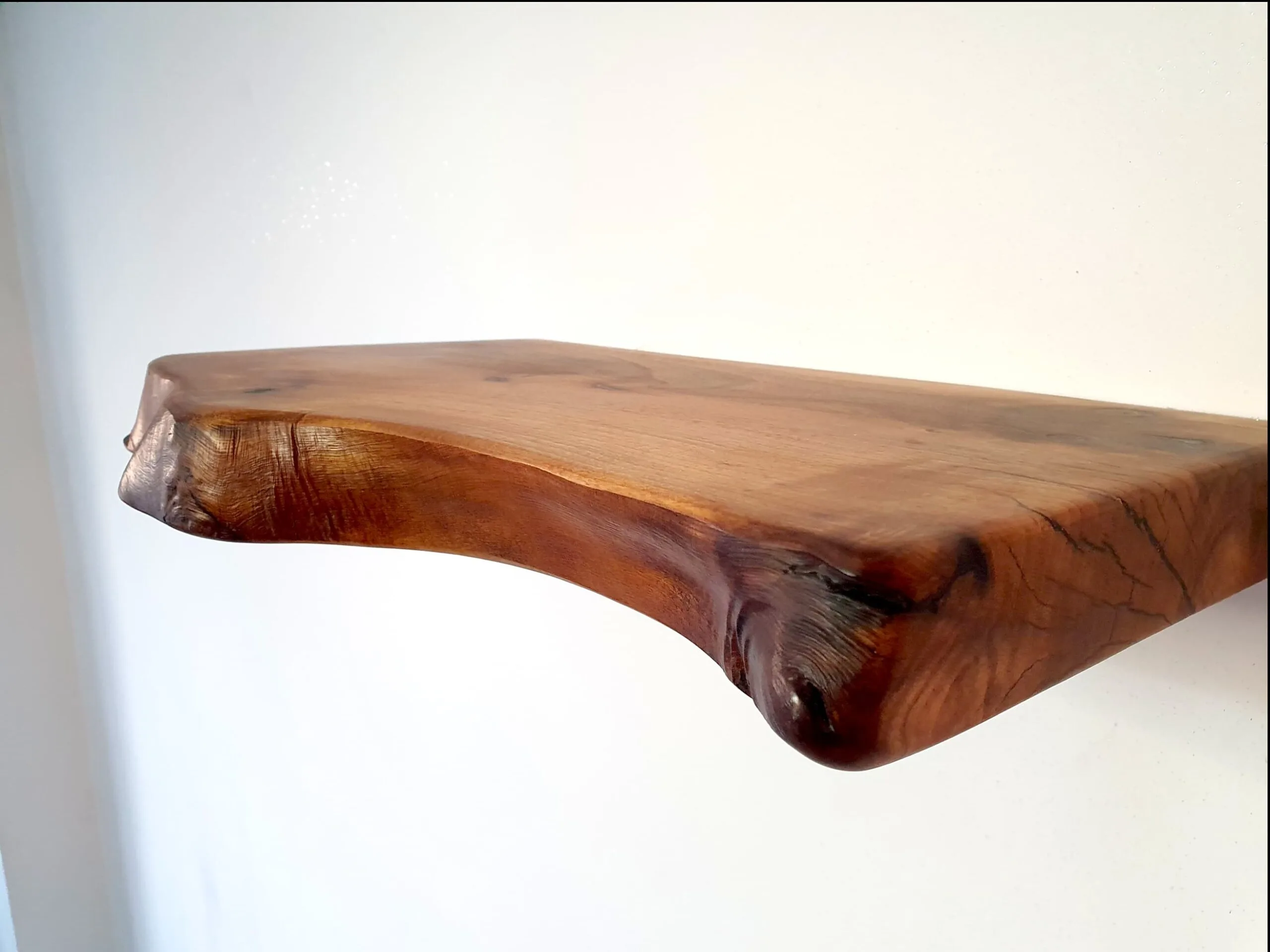 Side profile of walnut live edge shelf
