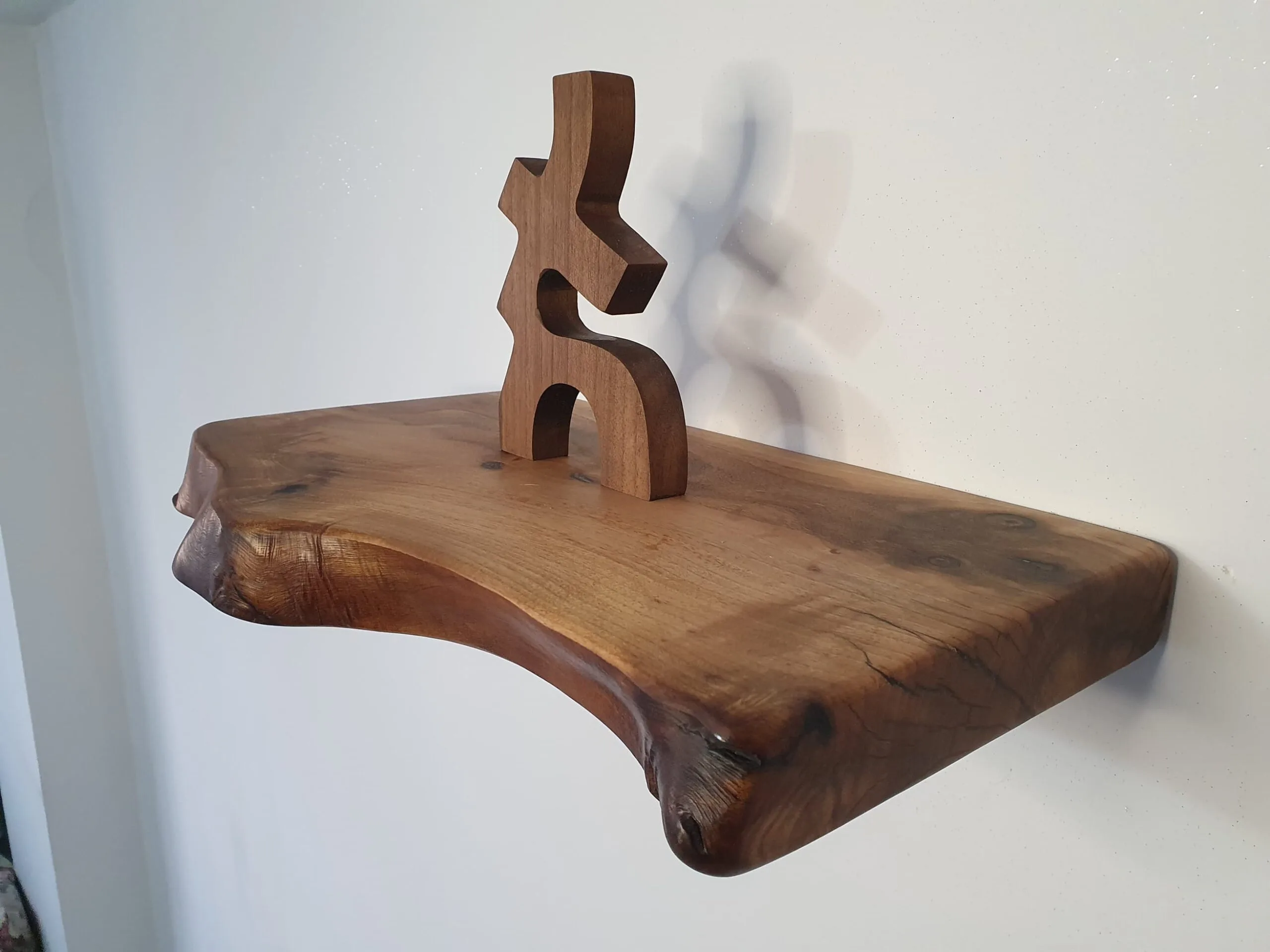 Styled floating walnut shelf