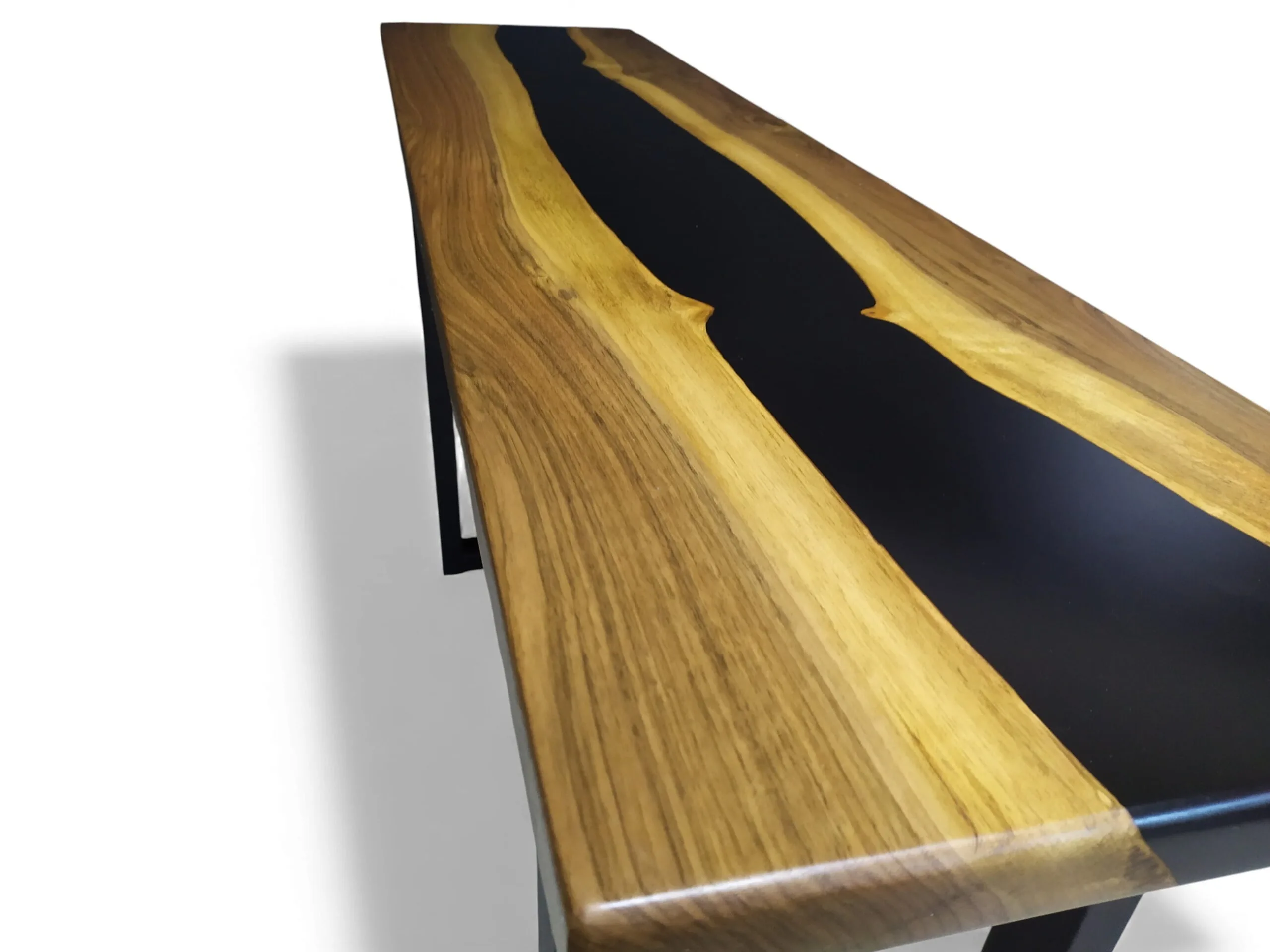 Close-up detail of walnut grain and epoxy