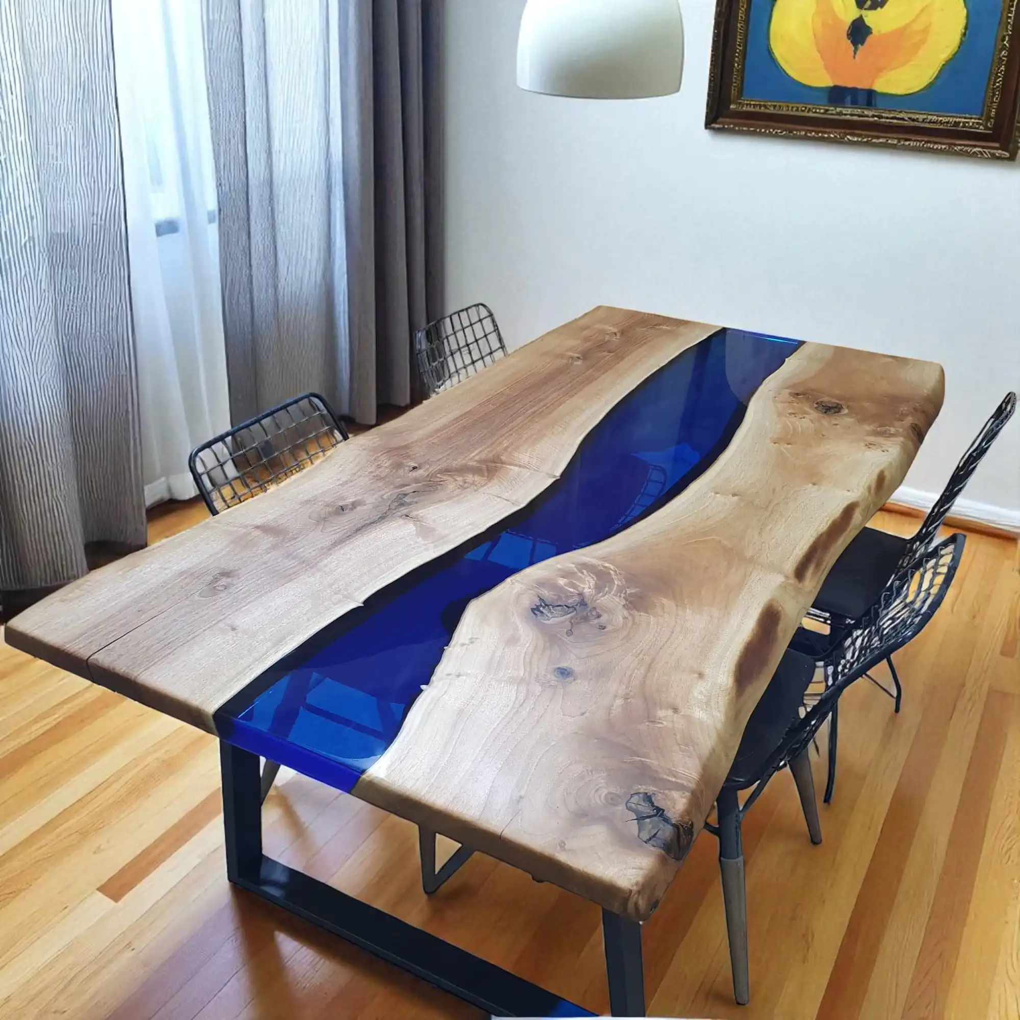 Blue epoxy river dining table with natural walnut slabs