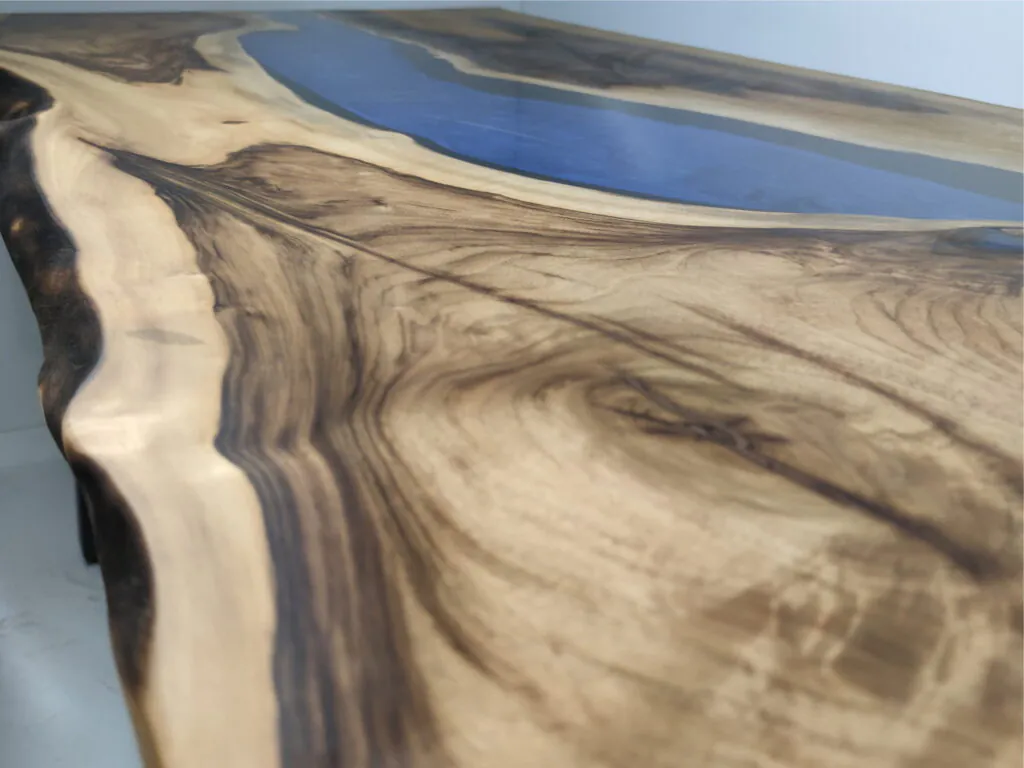 Natural walnut wood slab with preserved live edge and organic grain detail