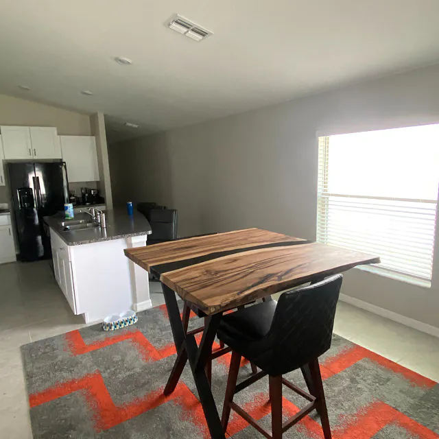 Modern interior with square black epoxy table