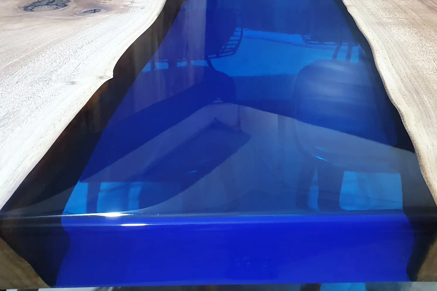 Walnut grain detail with transparent blue epoxy