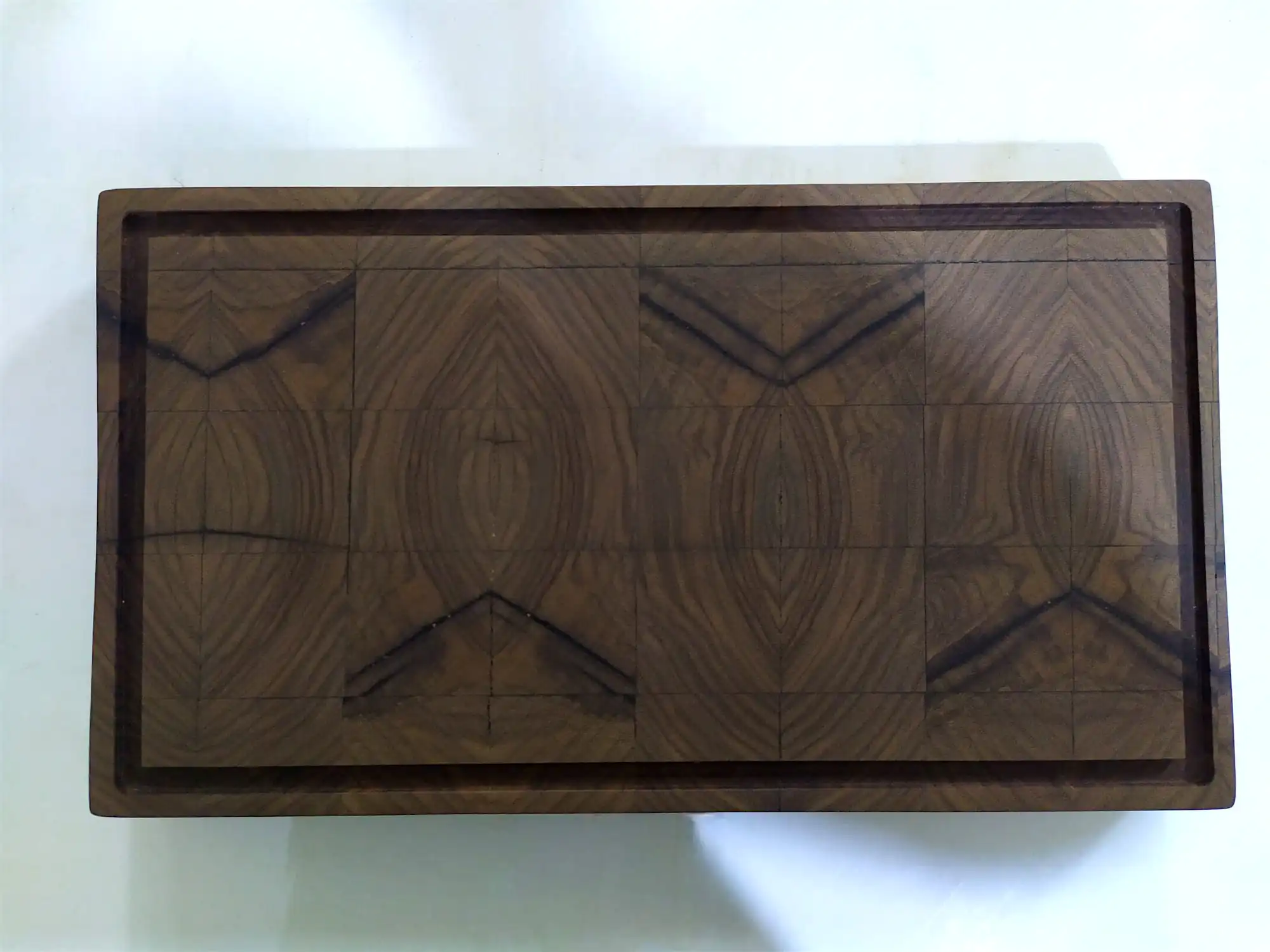 end grain cutting board with continuous grain pattern from the same hardwood slab