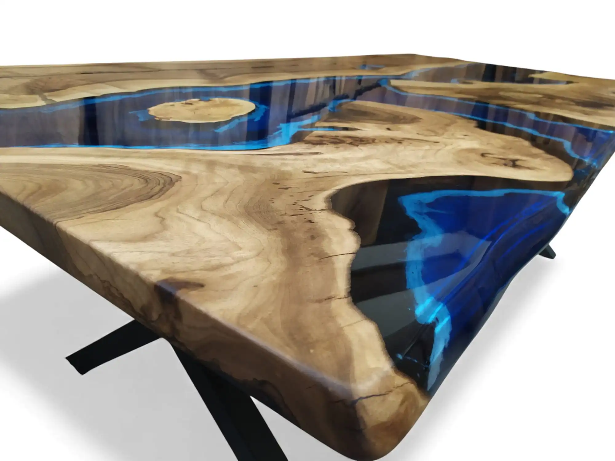 Close-up of the solid European walnut wood grain next to the blue and white epoxy resin.