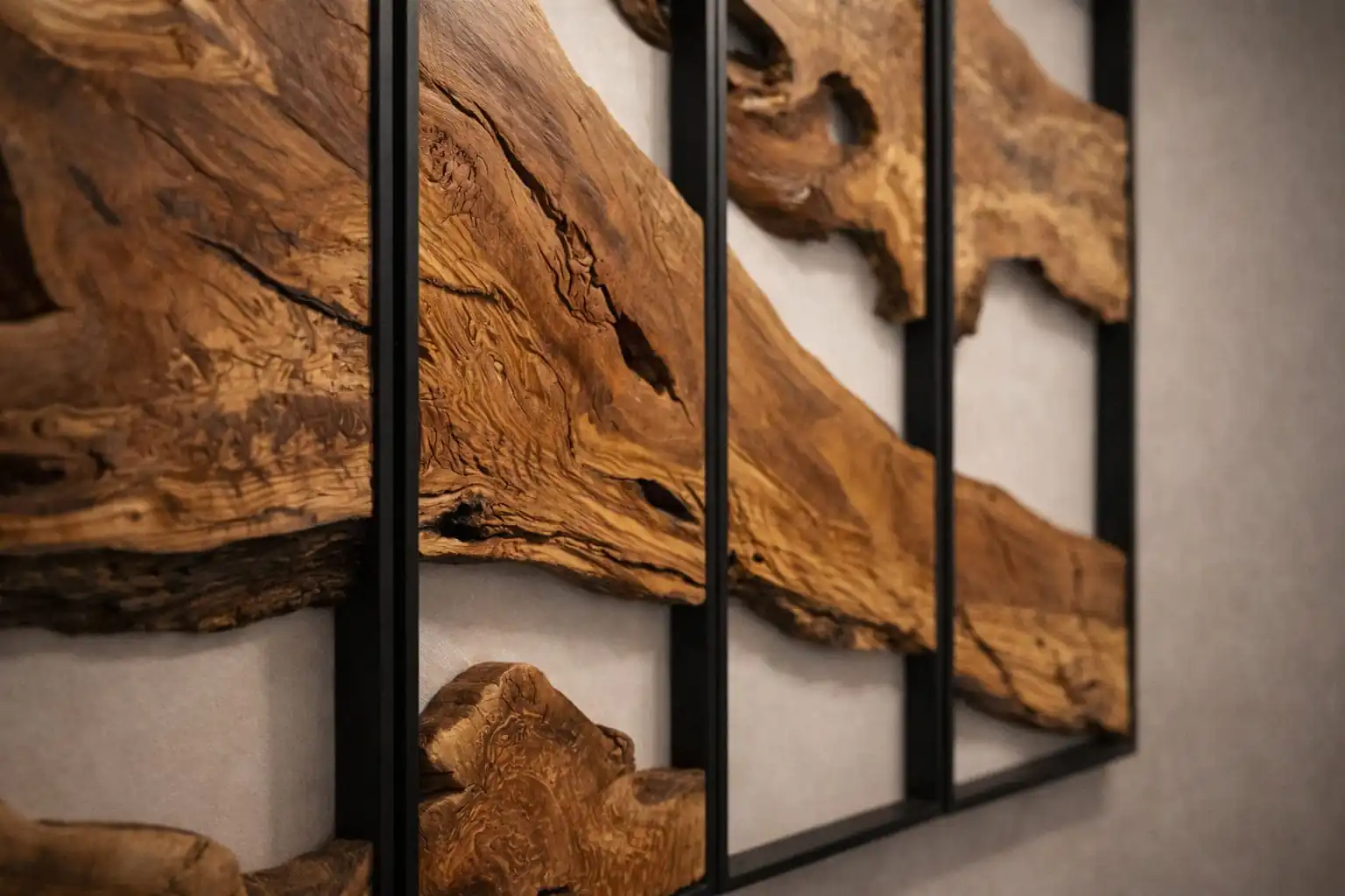 Detailed texture shot of the deep honey-toned grains and natural burls of our signature Olive Wood Rectangular Wall Art.