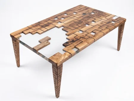 Close-up technical detail of the transparent resin poured inside the Pentomino Walnut Coffee Table frame.