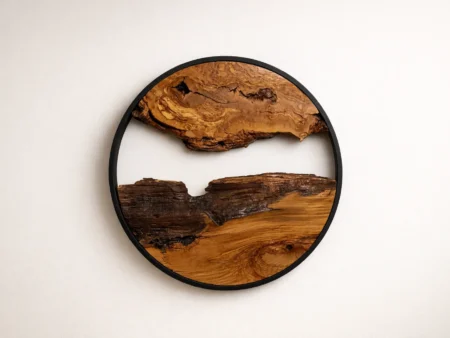Circular live edge olive wood art piece in a 24-inch configuration.
