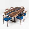 Bespoke epoxy dining table with chairs showcasing deep navy blue river and tailored Heritage seating.