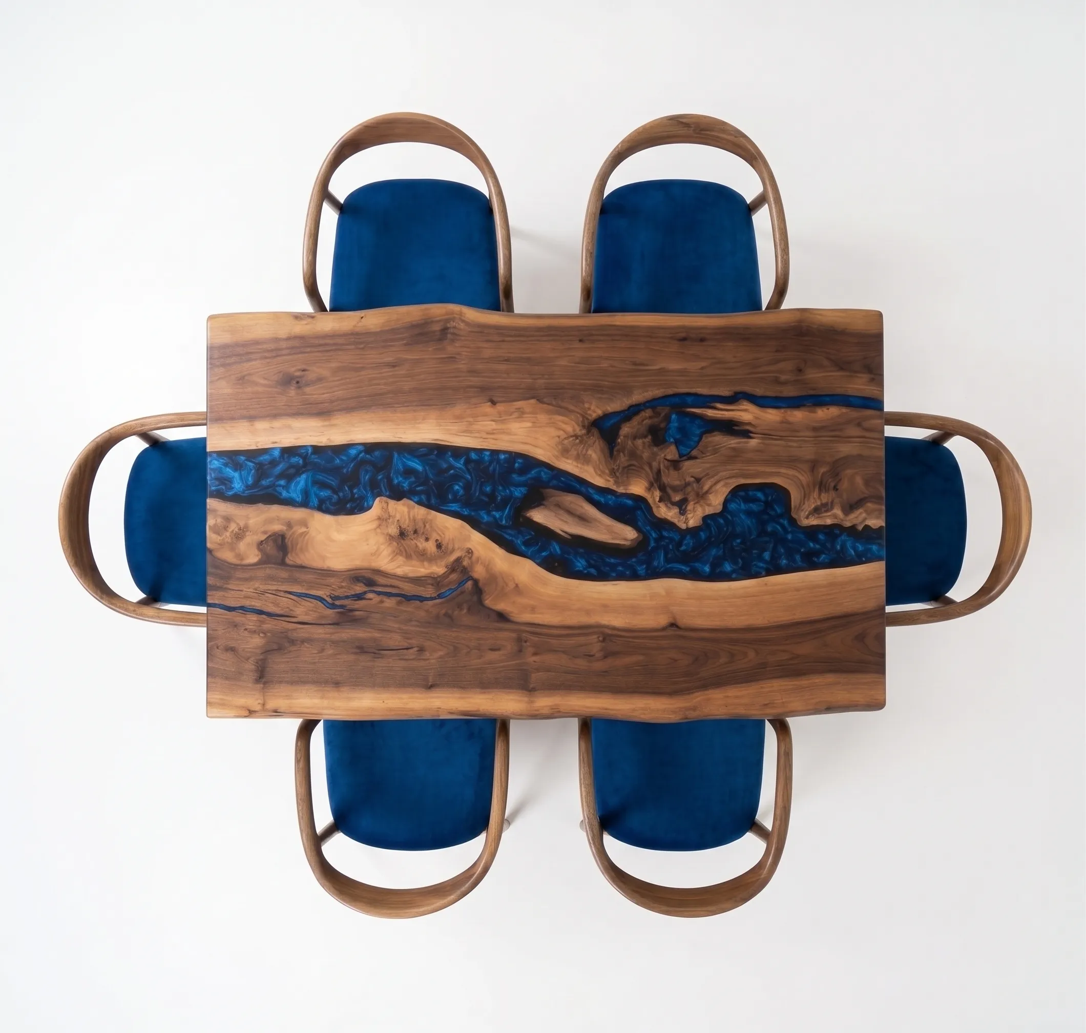Overhead flat lay view of navy blue epoxy dining table top showing natural European walnut grain and polymer river.